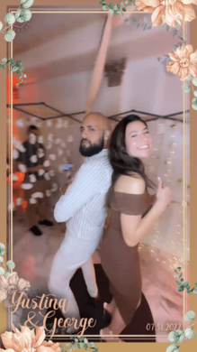 Couple posing on 360 photo booth